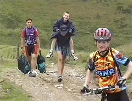 The Support Team generously help Alasdair up the climb